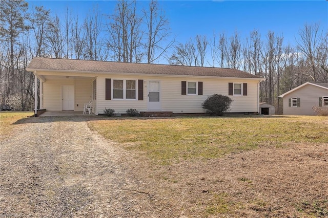 single story home with a front lawn and a carport