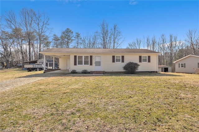 ranch-style home featuring a front yard and a carport