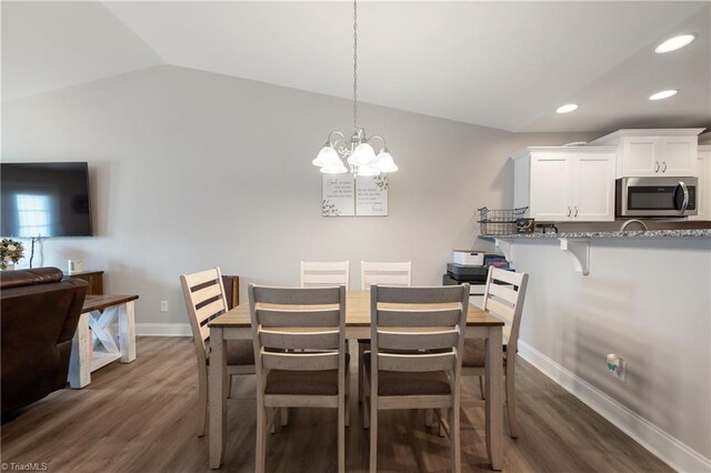 106 Oak Ridge Dr, Archdale, NC 27263 - dining space featuring dark wood finished floors, lofted ceiling, a chandelier, recessed lighting, and baseboards
