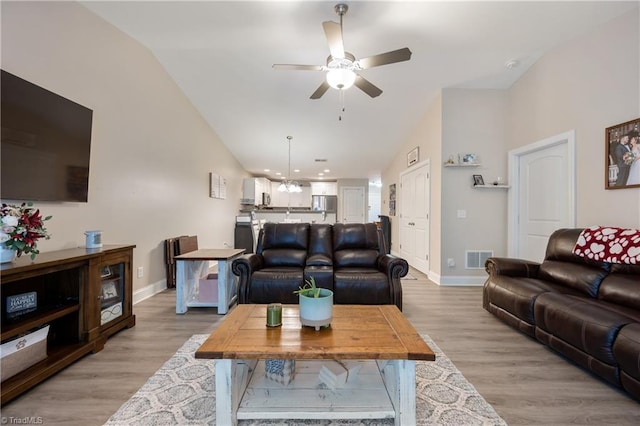 106 Oak Ridge Dr, Archdale, NC 27263 - living area featuring vaulted ceiling, a ceiling fan, baseboards, and light wood-style flooring