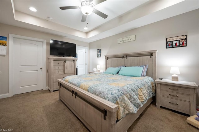 106 Oak Ridge Dr, Archdale, NC 27263 - bedroom featuring light colored carpet, a tray ceiling, recessed lighting, baseboards, and a ceiling fan