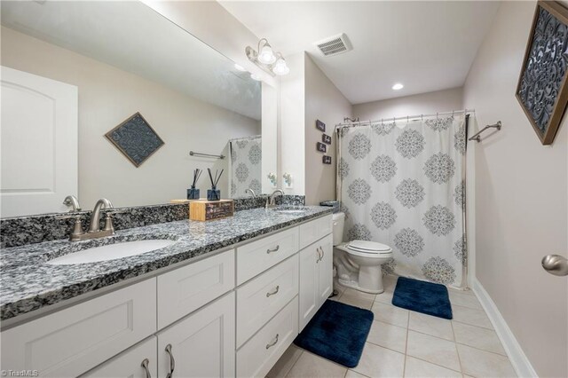 106 Oak Ridge Dr, Archdale, NC 27263 - full bath with toilet, tile patterned flooring, double vanity, curtained shower, and baseboards