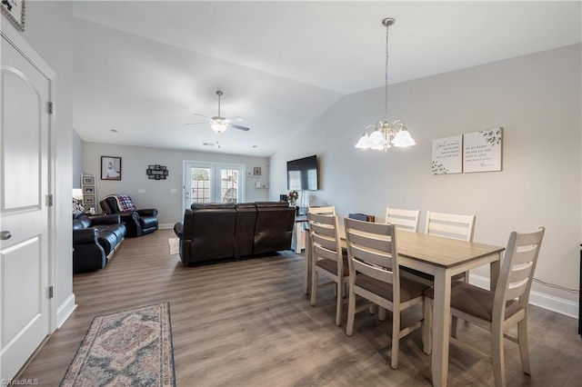 106 Oak Ridge Dr, Archdale, NC 27263 - dining space featuring lofted ceiling, wood finished floors, a ceiling fan, a chandelier, and baseboards