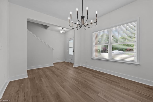1329 Union Cross Rd, Kernersville, NC 27284 - unfurnished dining area featuring a chandelier, wood finished floors, and baseboards