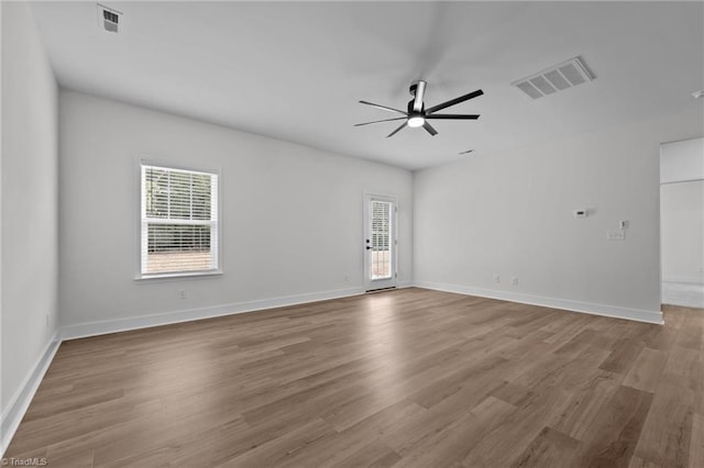 1329 Union Cross Rd, Kernersville, NC 27284 - unfurnished room with healthy amount of natural light, ceiling fan, wood finished floors, and baseboards