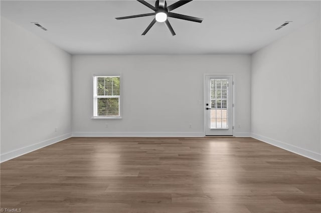 1329 Union Cross Rd, Kernersville, NC 27284 - spare room featuring ceiling fan, wood finished floors, and baseboards