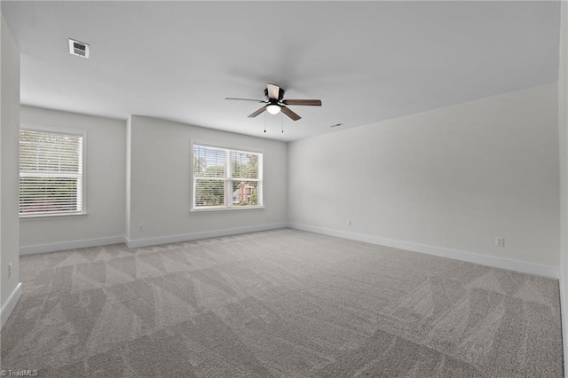 1329 Union Cross Rd, Kernersville, NC 27284 - empty room featuring a ceiling fan, light carpet, and baseboards