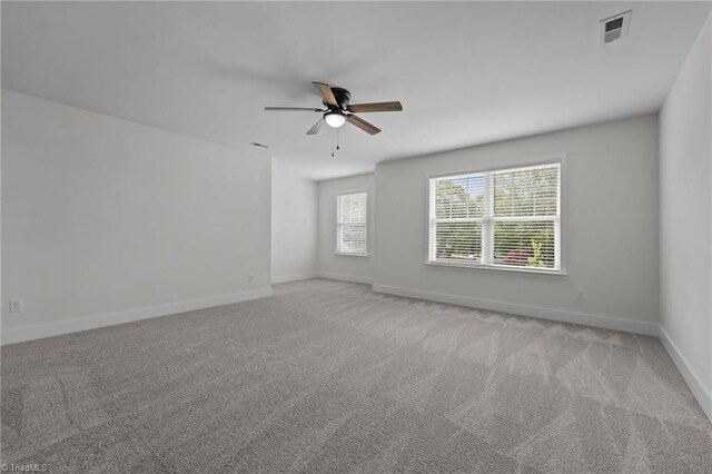 1329 Union Cross Rd, Kernersville, NC 27284 - empty room featuring a ceiling fan, light carpet, and baseboards