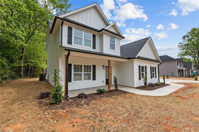 1329 Union Cross Rd, Kernersville, NC 27284 - view of front of house featuring board and batten siding, a porch, and roof with shingles