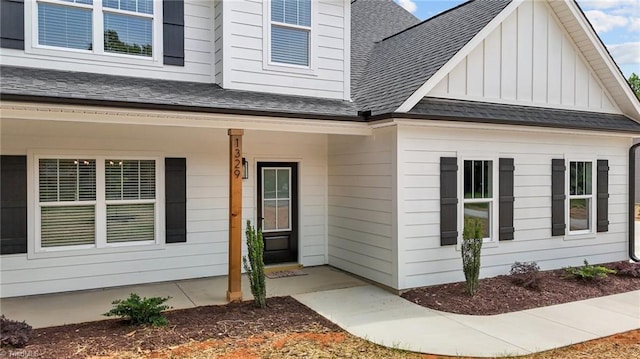 1329 Union Cross Rd, Kernersville, NC 27284 - property entrance with a shingled roof, board and batten siding, and covered porch