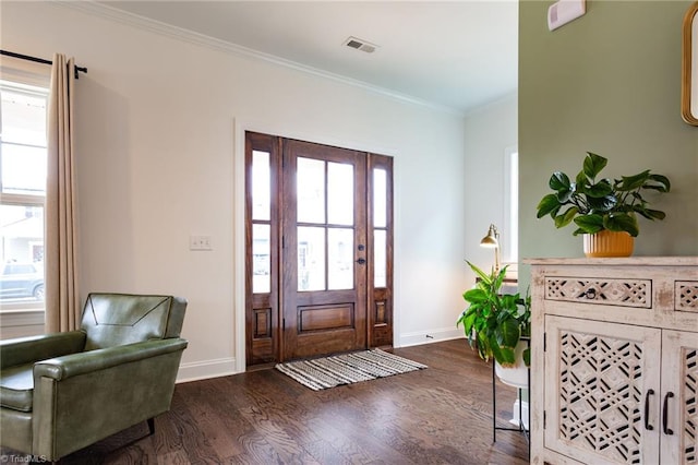 entrance foyer featuring dark hardwood / wood-style floors and crown molding