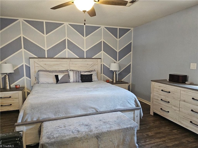 bedroom featuring dark wood-style floors, ceiling fan, and baseboards