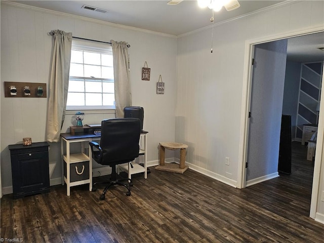 office space featuring visible vents, dark wood-type flooring, ornamental molding, a ceiling fan, and baseboards