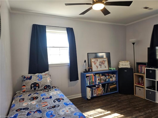 bedroom featuring ceiling fan, wood finished floors, visible vents, and crown molding