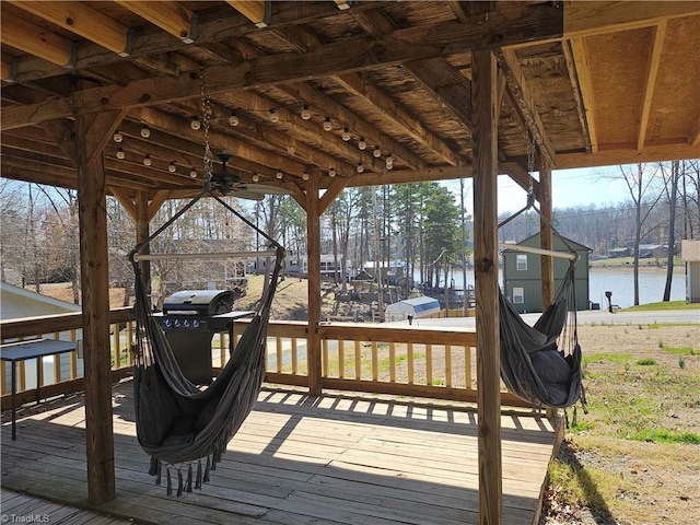 wooden deck with a water view