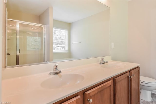 bathroom with vanity, toilet, and walk in shower