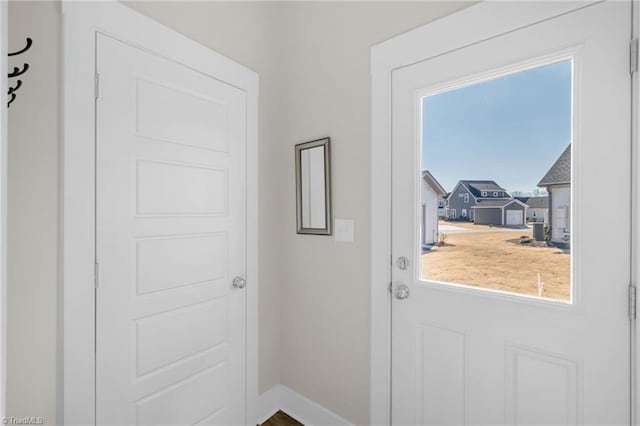 entryway featuring baseboards