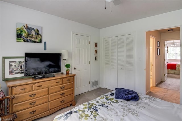 bedroom featuring carpet, a closet, and ceiling fan