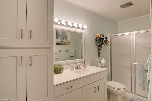 full bathroom with toilet, a stall shower, vanity, and crown molding