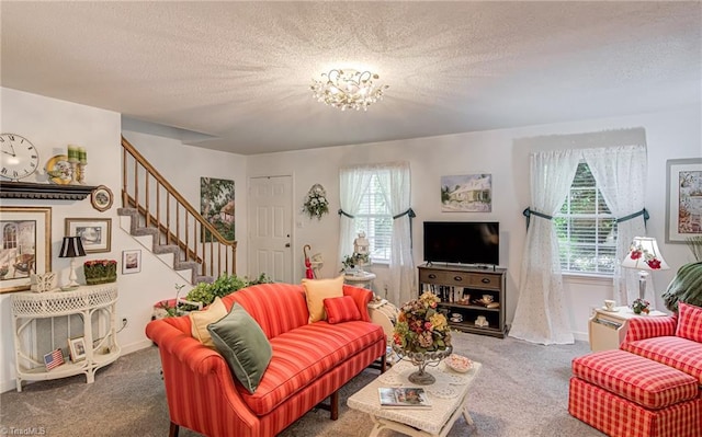carpeted living area featuring stairs, baseboards, a chandelier, and a textured ceiling