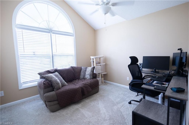 office space with ceiling fan, carpet flooring, lofted ceiling, and baseboards