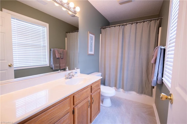 bathroom featuring vanity, tile patterned floors, and toilet