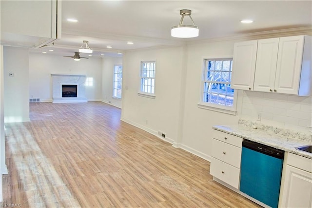 kitchen featuring dishwashing machine, light hardwood / wood-style flooring, white cabinetry, decorative backsplash, and decorative light fixtures