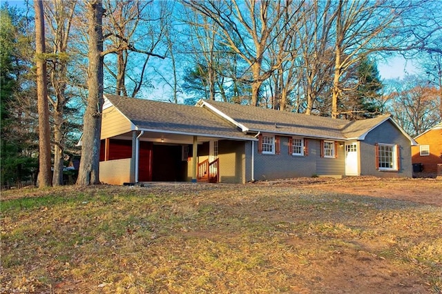 ranch-style home featuring a garage