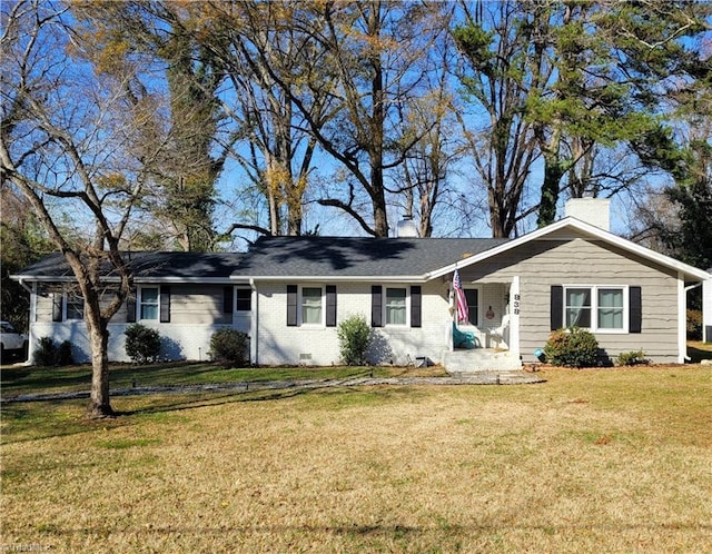 ranch-style house with crawl space, brick siding, a chimney, and a front lawn