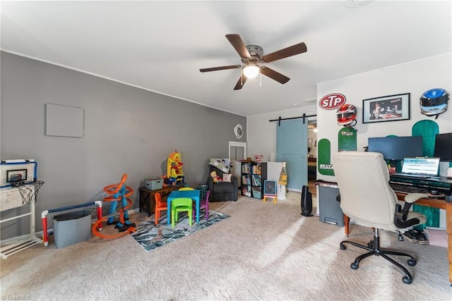 interior space featuring carpet flooring, ceiling fan, and a barn door