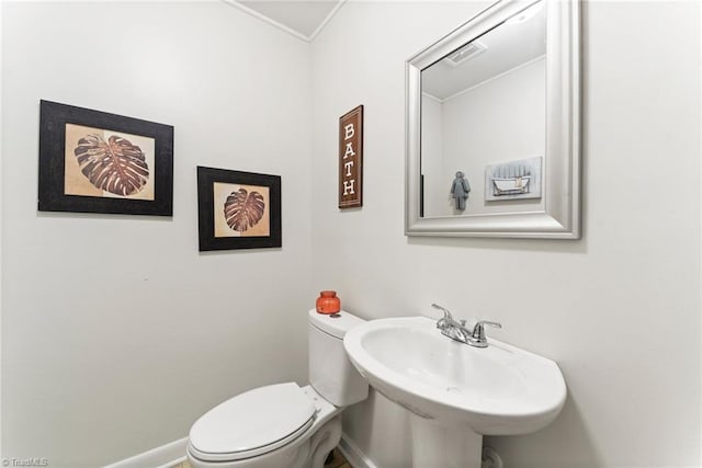 bathroom featuring toilet and sink