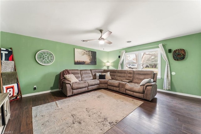 living room with dark hardwood / wood-style floors and ceiling fan