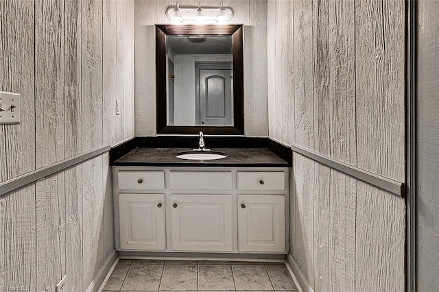 bathroom featuring tile patterned flooring and vanity