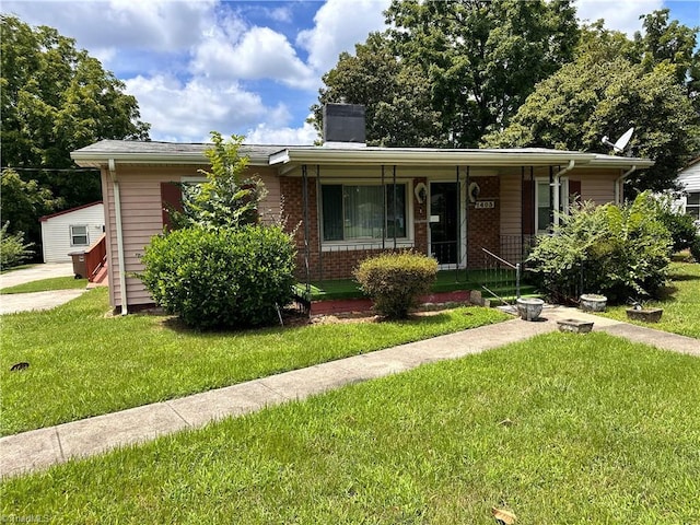 bungalow-style house with a front lawn and a porch