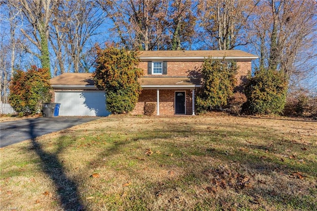 view of front of house with a garage and a front yard