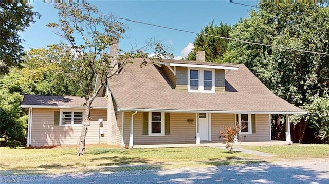 1023 Spring St, Mount Airy, NC 27030 - view of front of home with a chimney, a front lawn, a porch, and a shingled roof