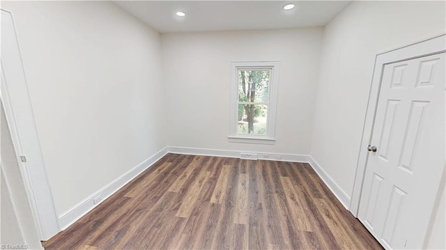 1023 Spring St, Mount Airy, NC 27030 - empty room featuring dark wood-style flooring and recessed lighting