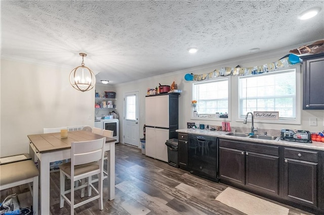 kitchen with a sink, dishwasher, washing machine and dryer, and ornamental molding
