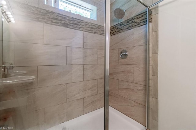 full bath featuring tiled shower