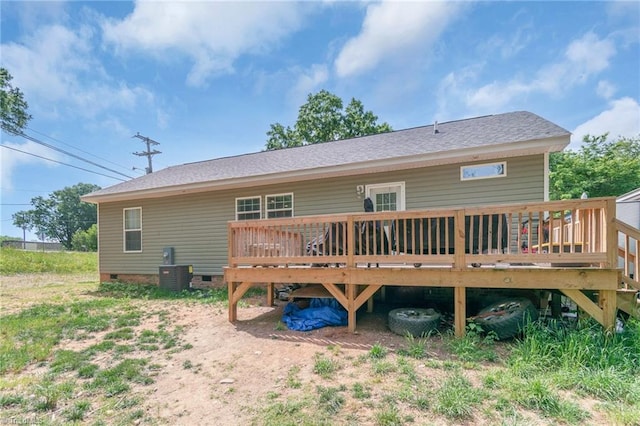rear view of house featuring roof with shingles, central AC, a deck, and crawl space