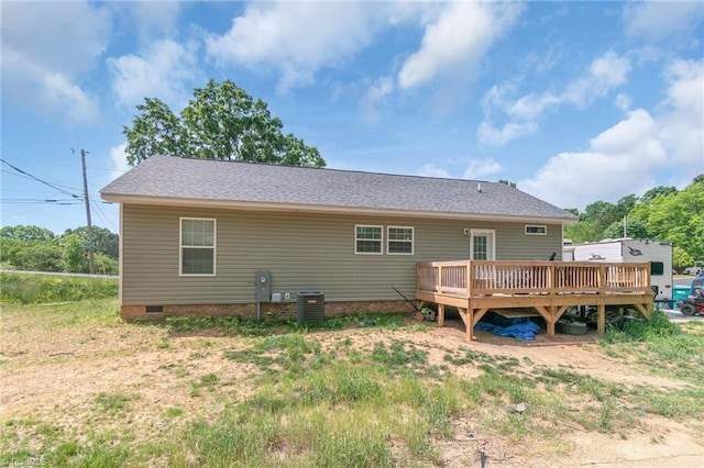 back of property featuring central AC unit, a deck, and crawl space