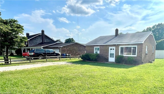 6327 Blazing Star Dr, Archdale, NC 27263 - view of front facade with driveway, brick siding, fence, and a front yard