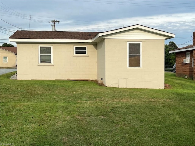 6327 Blazing Star Dr, Archdale, NC 27263 - rear view of house featuring cooling unit, concrete block siding, roof with shingles, and a yard