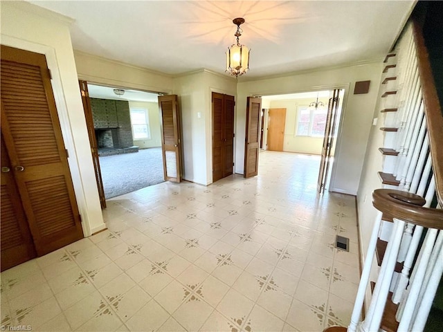 6327 Blazing Star Dr, Archdale, NC 27263 - interior space featuring visible vents, a chandelier, crown molding, stairway, and light floors