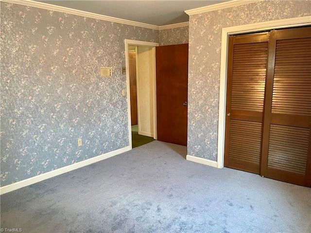 unfurnished bedroom featuring a closet, carpet flooring, and crown molding