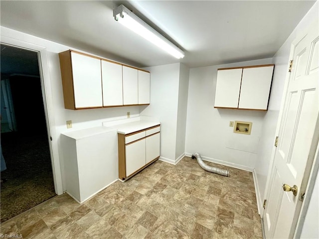 laundry room with cabinets, hookup for a washing machine, and light tile patterned floors