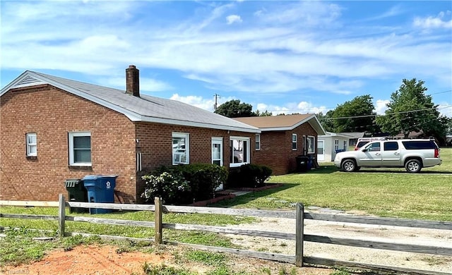 6327 Blazing Star Dr, Archdale, NC 27263 - view of property exterior featuring a chimney, brick siding, fence, and a lawn