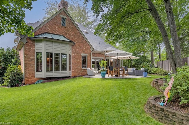 3705 Bradwyck Cir, Winston-Salem, NC 27104 - rear view of house with brick siding, a patio area, a chimney, and outdoor lounge area