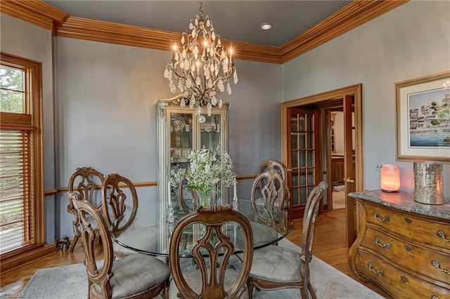 3705 Bradwyck Cir, Winston-Salem, NC 27104 - dining area with a chandelier, crown molding, and wood finished floors
