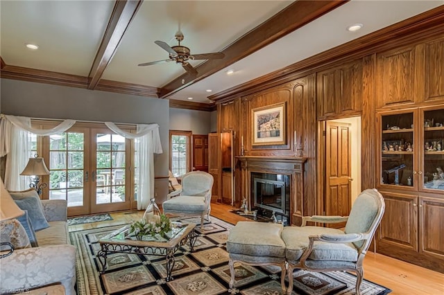 3705 Bradwyck Cir, Winston-Salem, NC 27104 - living area featuring a fireplace, beamed ceiling, french doors, ceiling fan, and ornamental molding